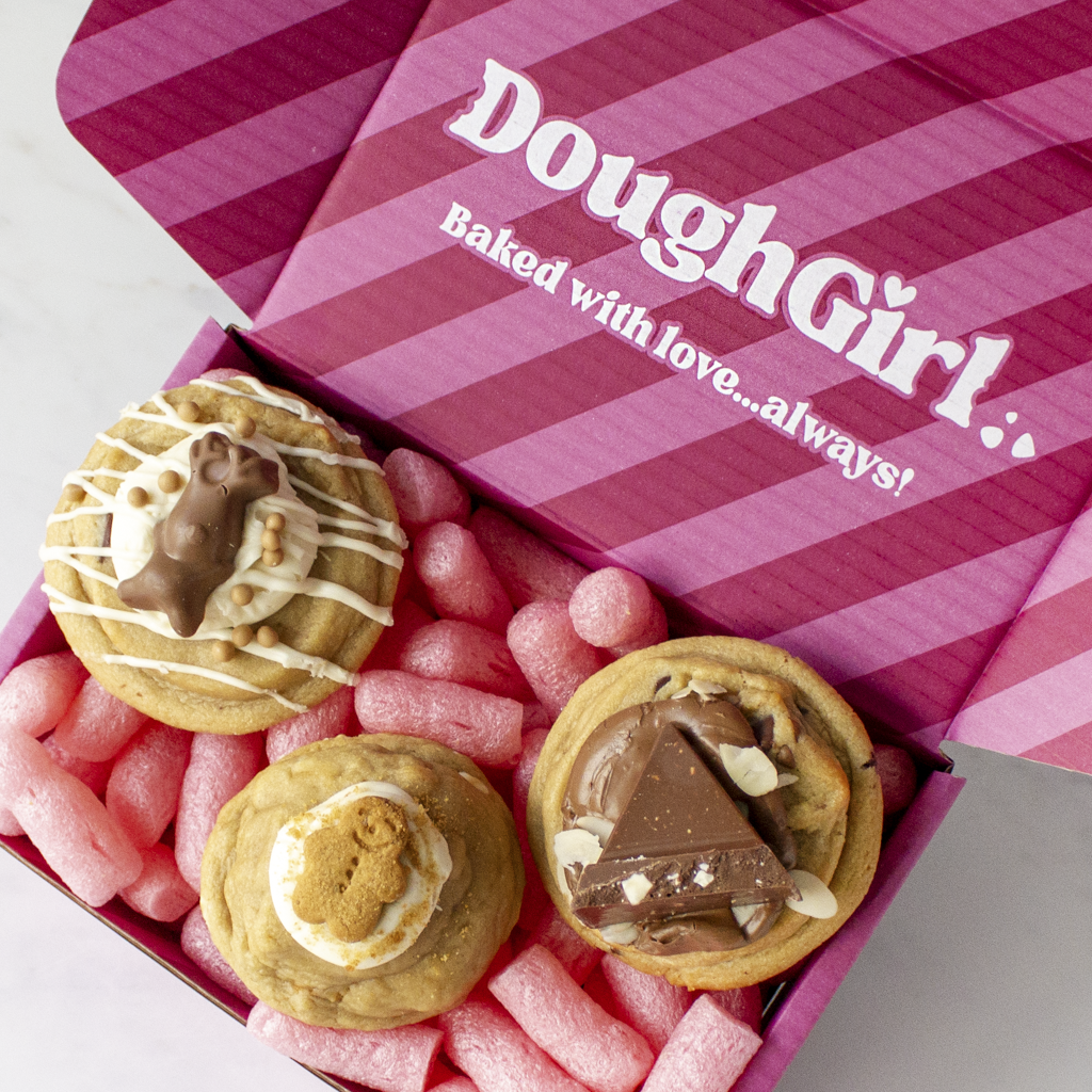 DoughGirl festive cookie gift box with assorted cookies on pink packaging