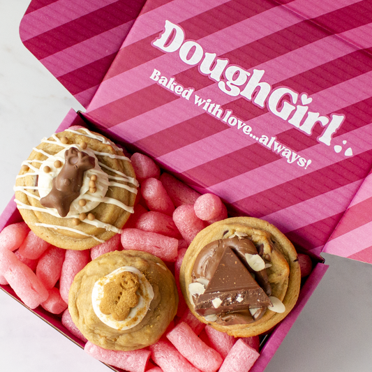 DoughGirl festive cookie gift box with assorted cookies on pink packaging