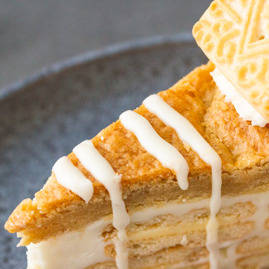 Closed up to a DoughGirl Cookie pie slice on a grey plate 