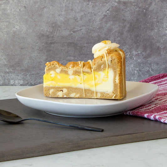 DoughGirl cookie pie slice on a white plate against a neutral background