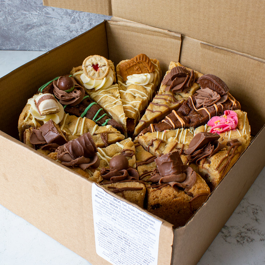 DoughGirl Full cookie pie in a box against a grey background