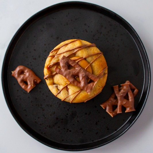 DoughGirl Luxury Cookie with Curly Wurly on  a black plate