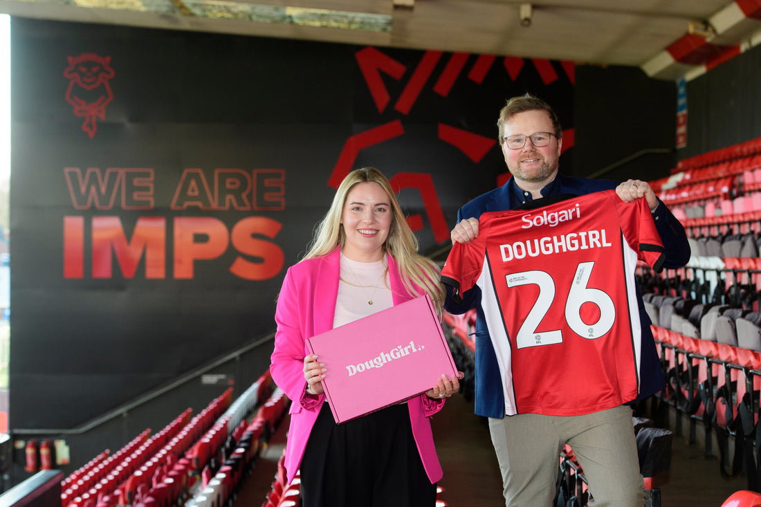DoughGirl partnership announcement with branded box and Lincoln City football shirt