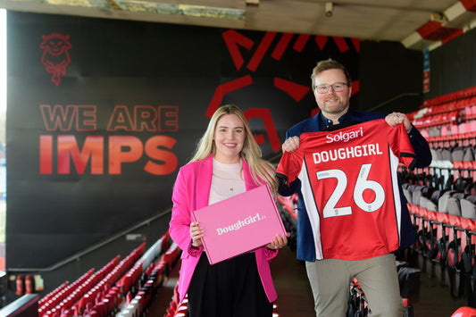 DoughGirl partnership announcement with branded box and Lincoln City football shirt