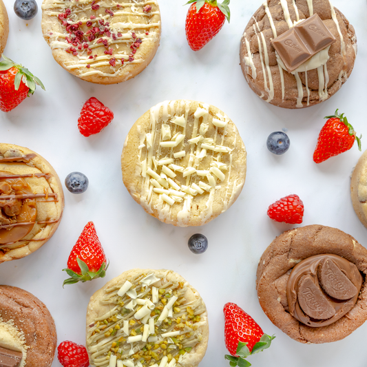 DoughGirl summer cookies with strawberries and blueberries on a white background, and a subtle summer feel. Store cookies in a cool dry place for the best texture.