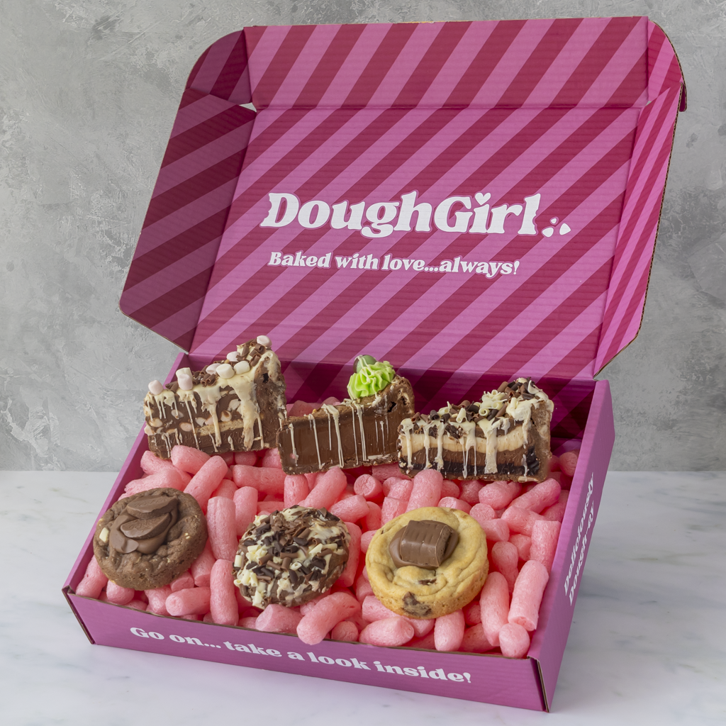 DoughGirl pink gift box filled with milk chocolate cookie pies, chocolate dessert slices and deluxe cookies