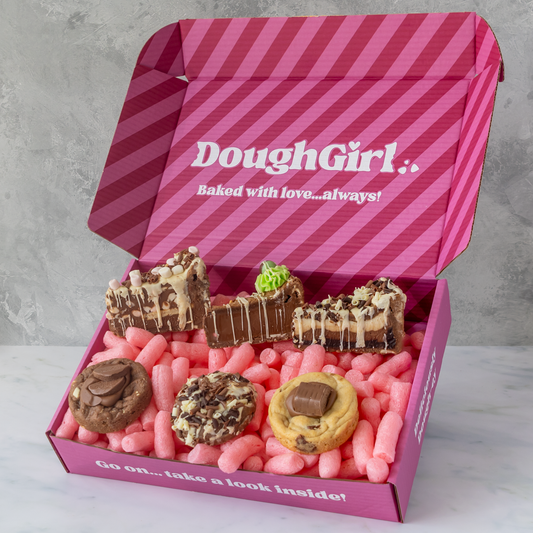 DoughGirl pink gift box filled with milk chocolate cookie pies, chocolate dessert slices and deluxe cookies