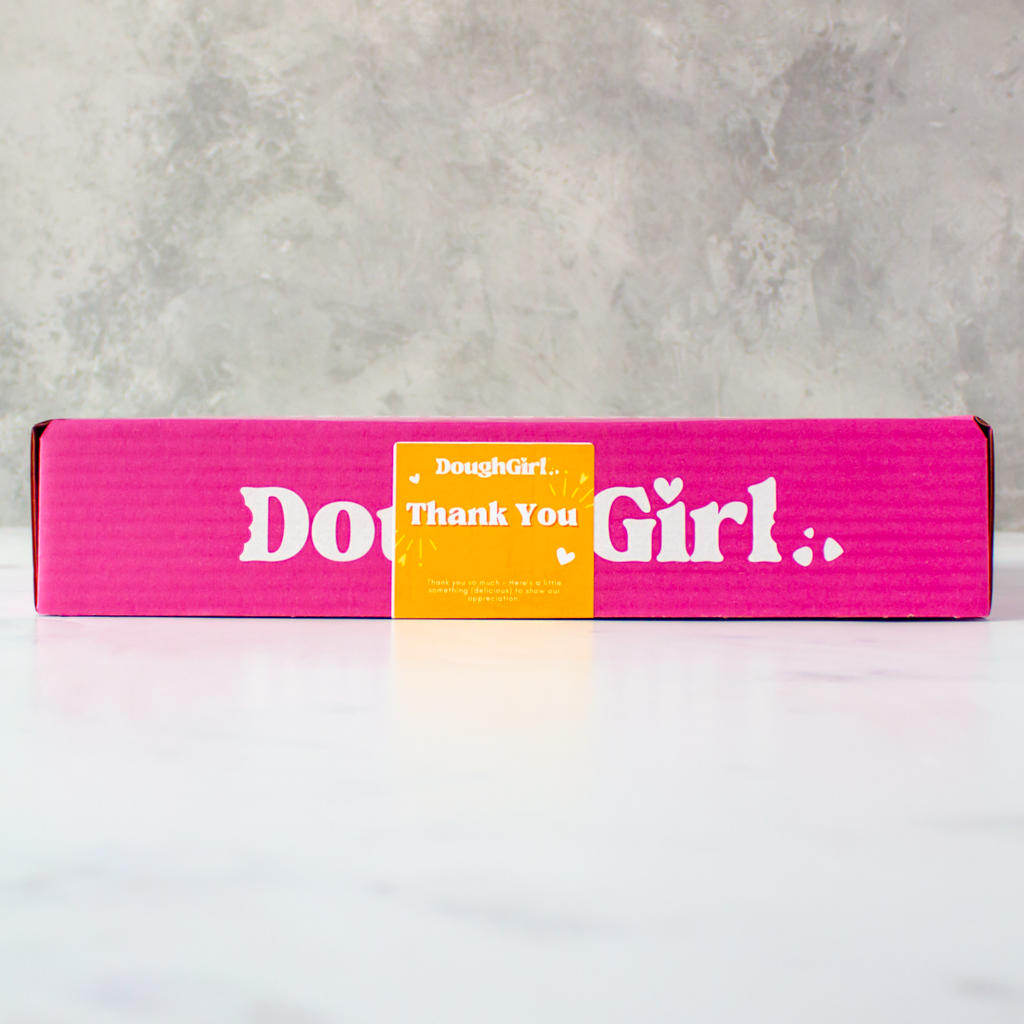 Pink box with 'DoughGirl Thank You' branding on a gray background