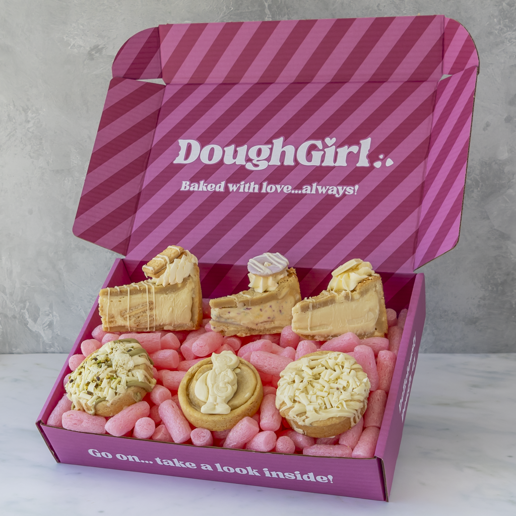 DoughGirl pink gift box filled with white chocolate cookie pies, deluxe cookies and pale chocolate-topped treats