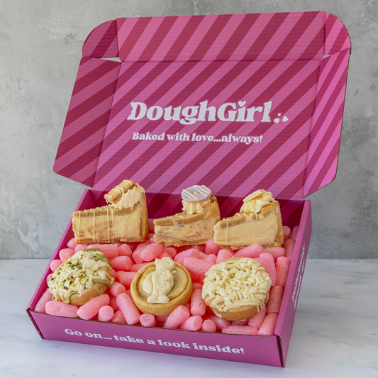 DoughGirl pink gift box filled with white chocolate cookie pies, deluxe cookies and pale chocolate-topped treats