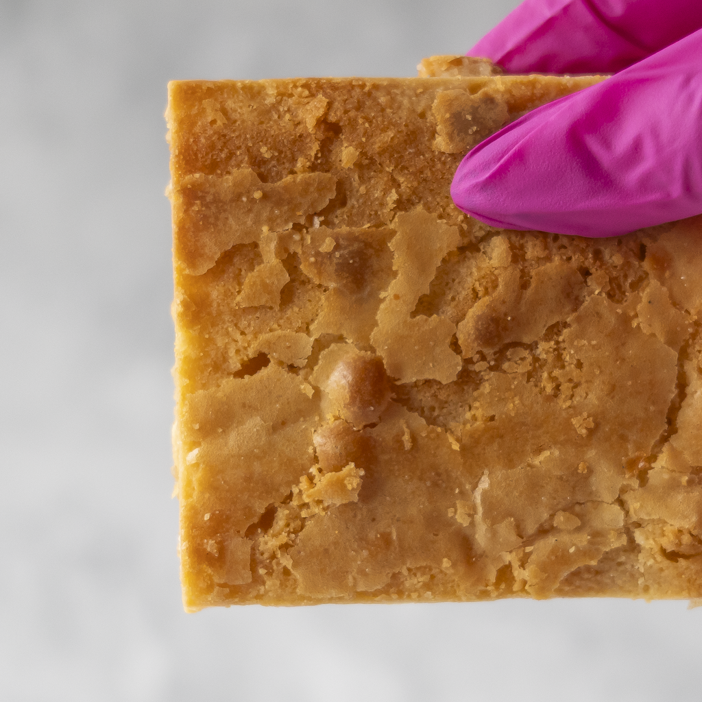 Close-up of Classic Blondie Slab showing golden top and white chocolate pieces