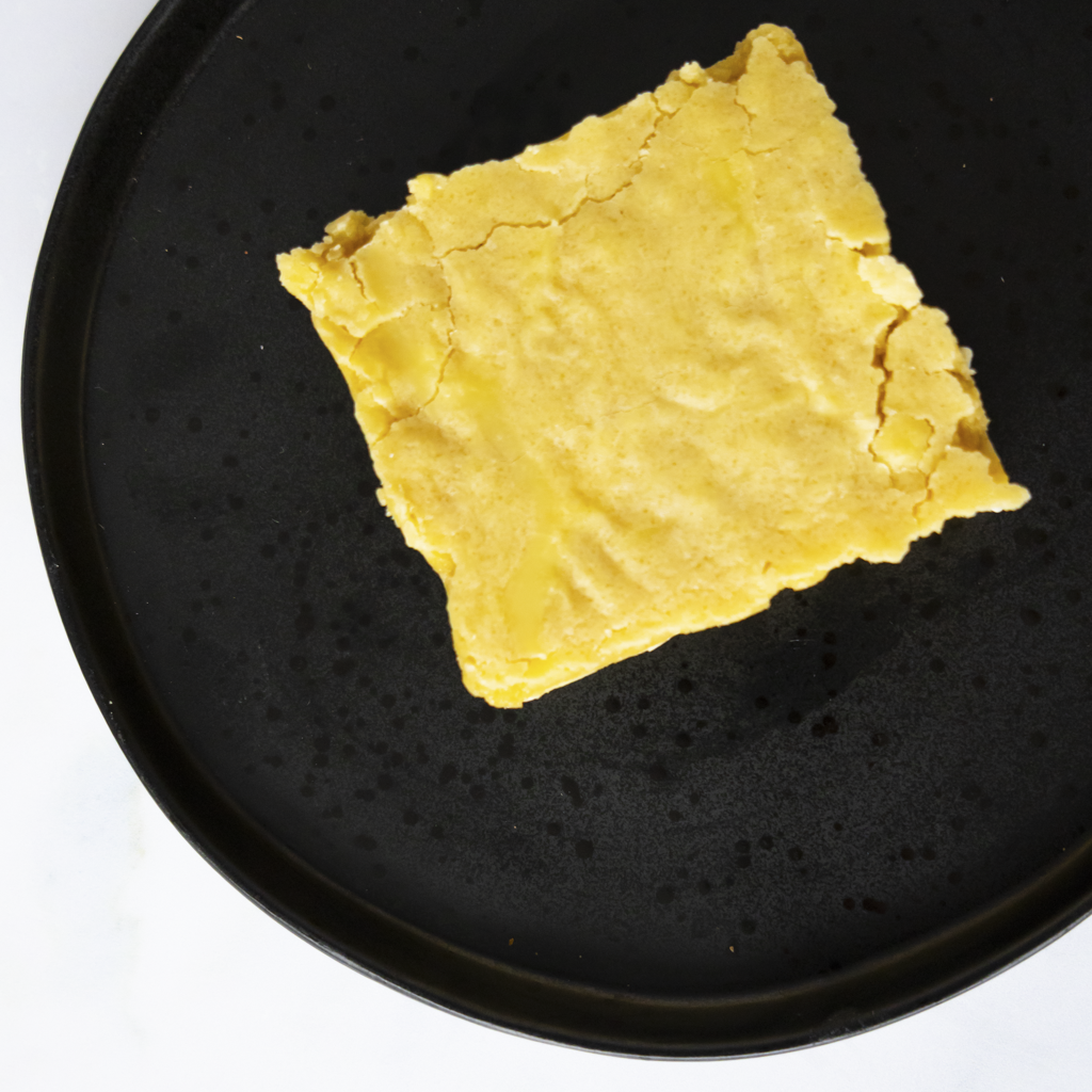 Classic Brookie Slab on a black plate, perfect for dessert or sweet treat
