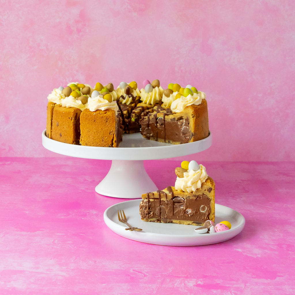 Chocolate dessert with Easter decorations on a pink background