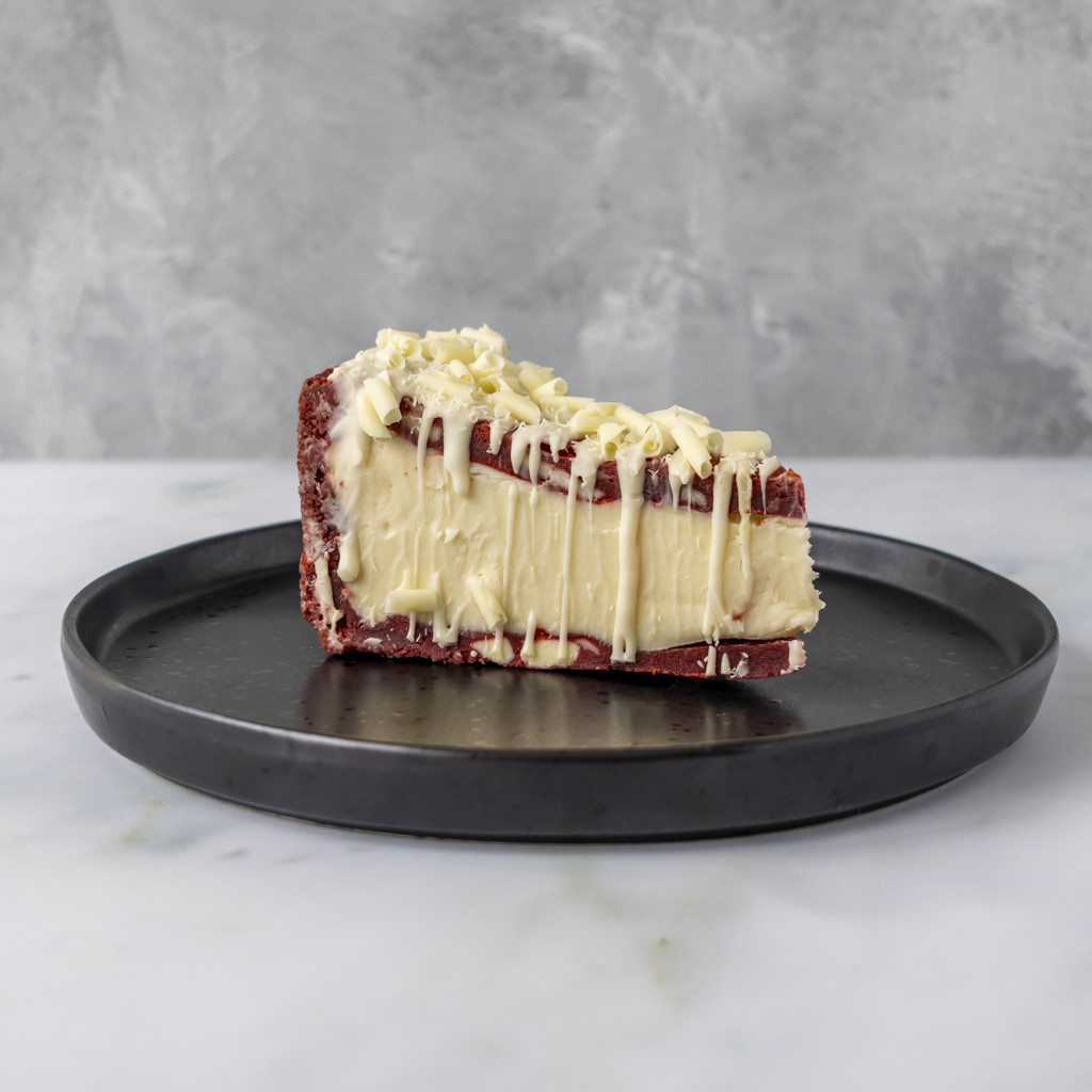DoughGirl Red Velvet Cookie Pie Slice on black plate with red velvet cookie base