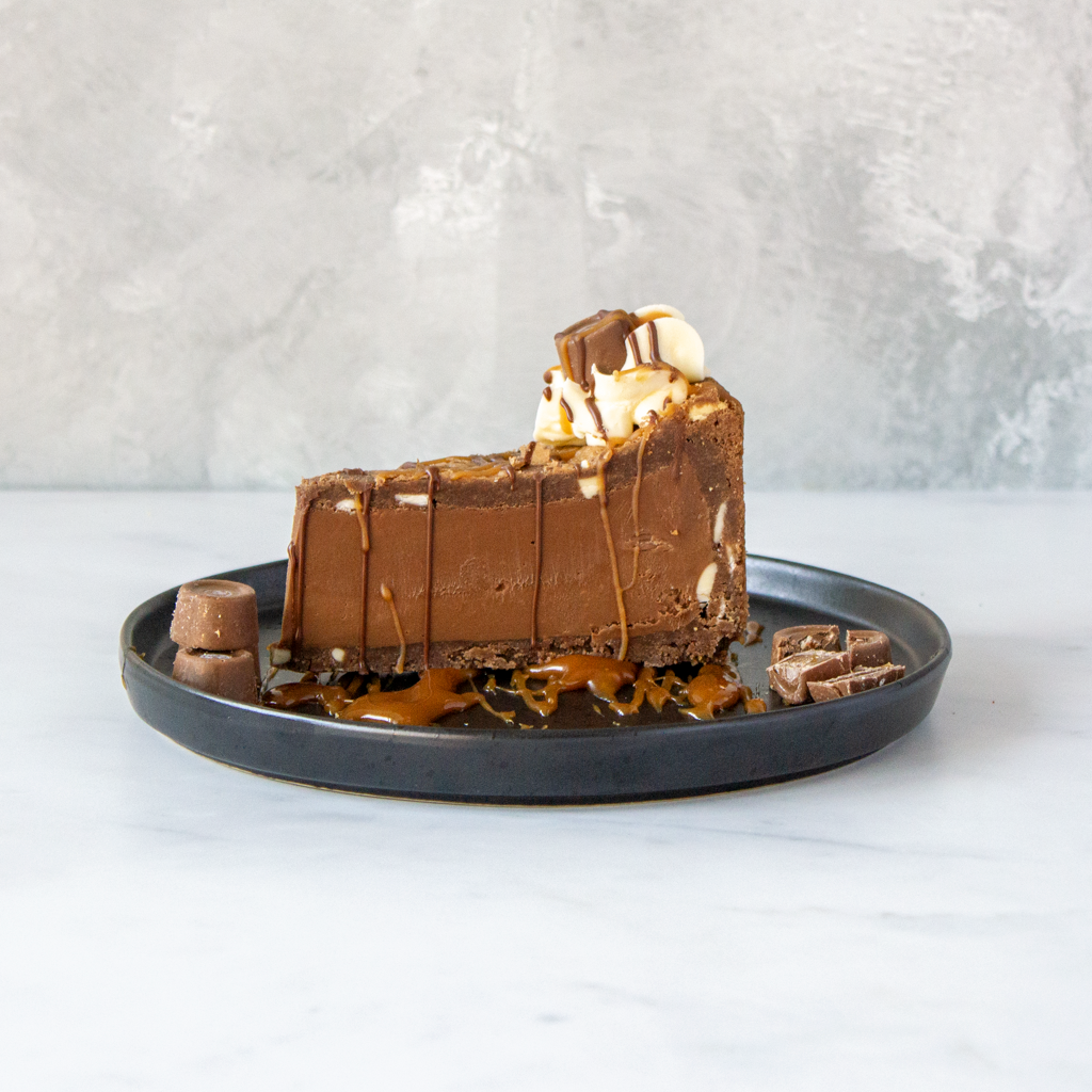 Beale Rolo Add Cookie Pie Slice with Rolo served on black plate with chocolate ...