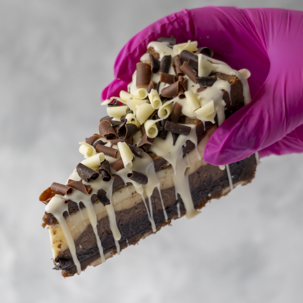 DoughGirl Triple Chocolate Cookie Pie Slice with white, milk and dark chocolate curls