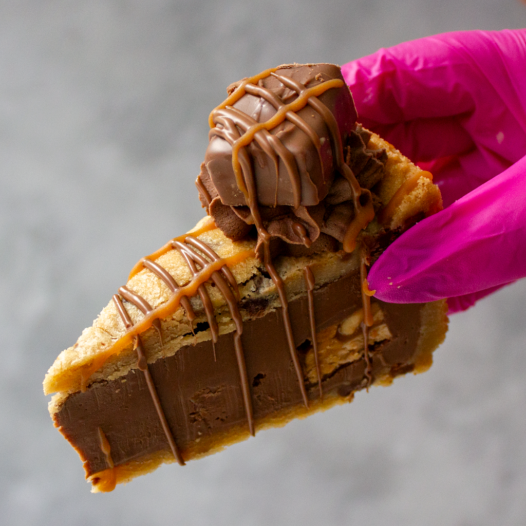 DoughGirl Cookie Pie Slice with Snickers, chocolate drizzle and caramel filling