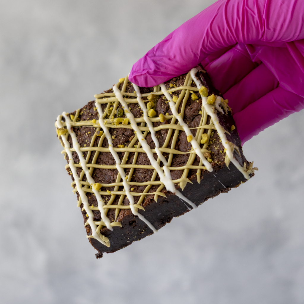 DoughGirl Pistachio Brownie Slab with white chocolate drizzle, pistachio drizzle and crushed pistachios