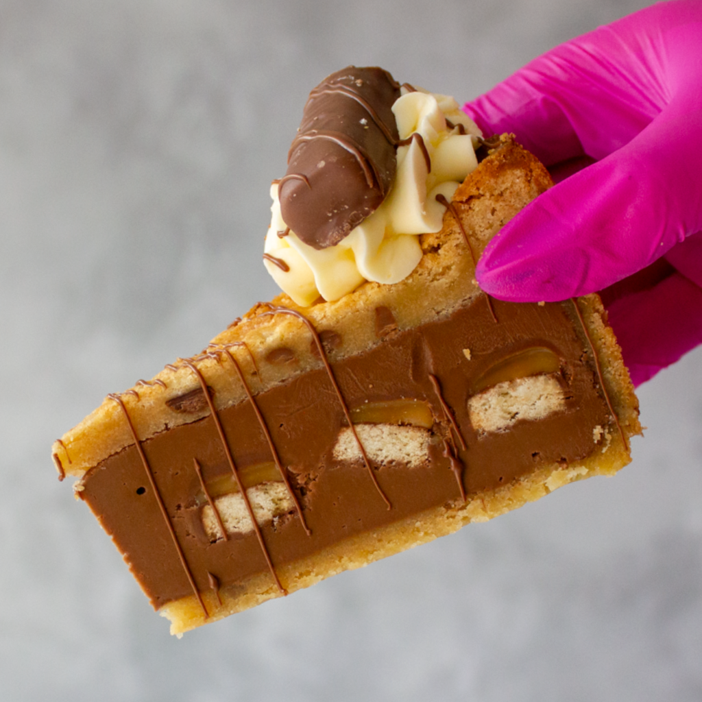 DoughGirl Cookie Pie Slice with Twix, milk chocolate buttercream and white chocolate drizzle