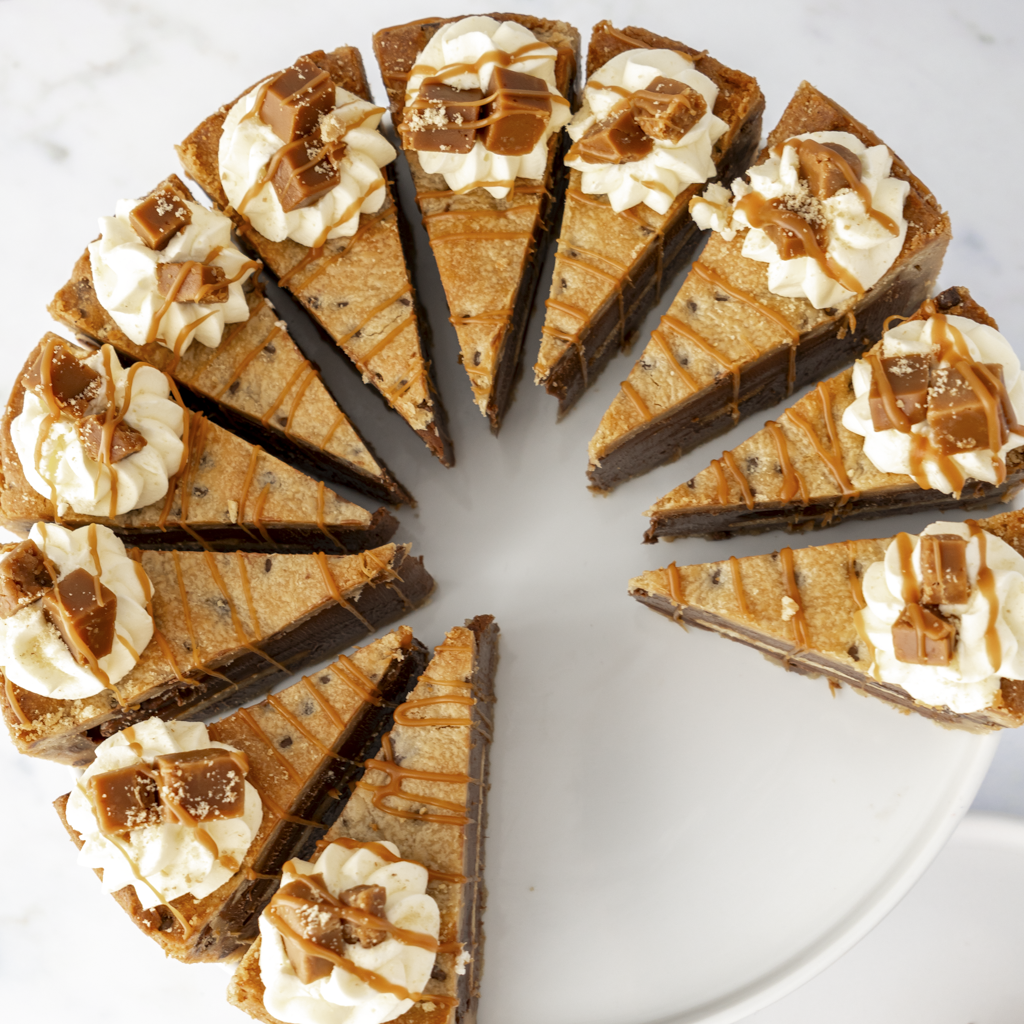 Full Banoffee Cookie Pie with Chocolate and caramel layeres on a white plate