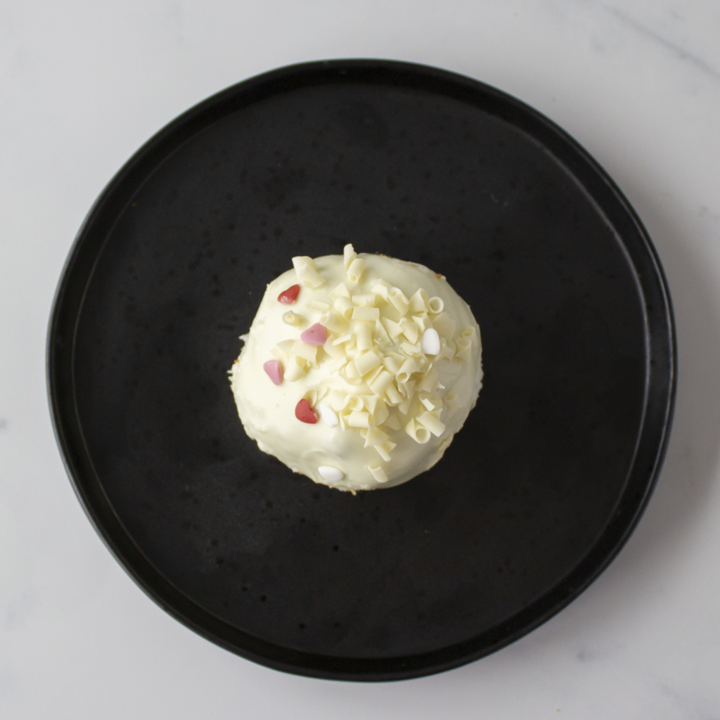 Filthy Fluff Brookie Choccy Boom Bites with white chocolate shavings on a black plate
