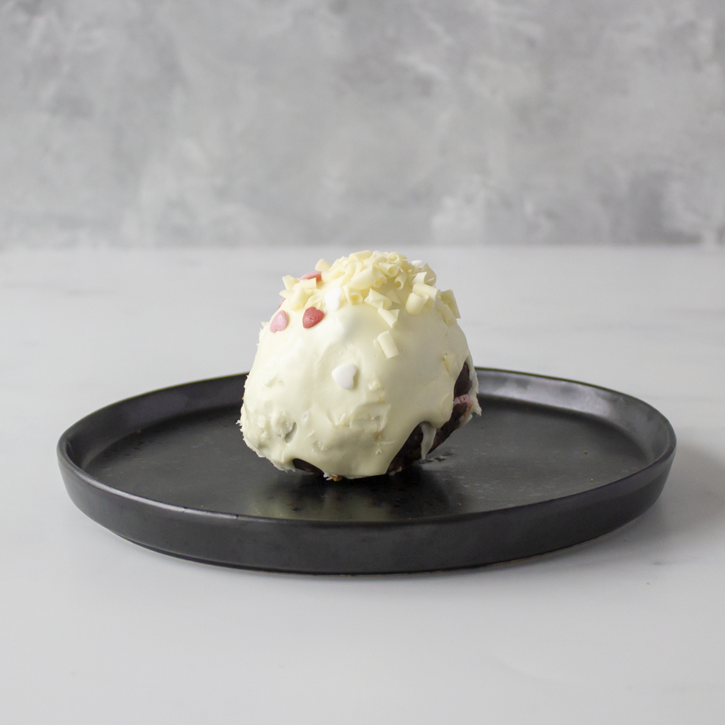 Filthy Fluff Brookie Choccy Boom Bites on a black plate with a gray background