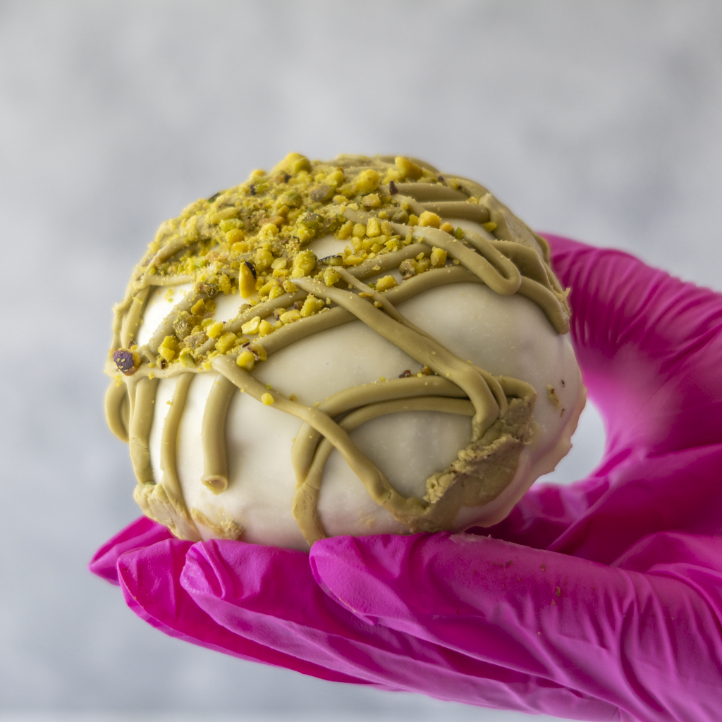 DoughGirl Pistachio Choccy Boom Bite with white chocolate coating and pistachio drizzle