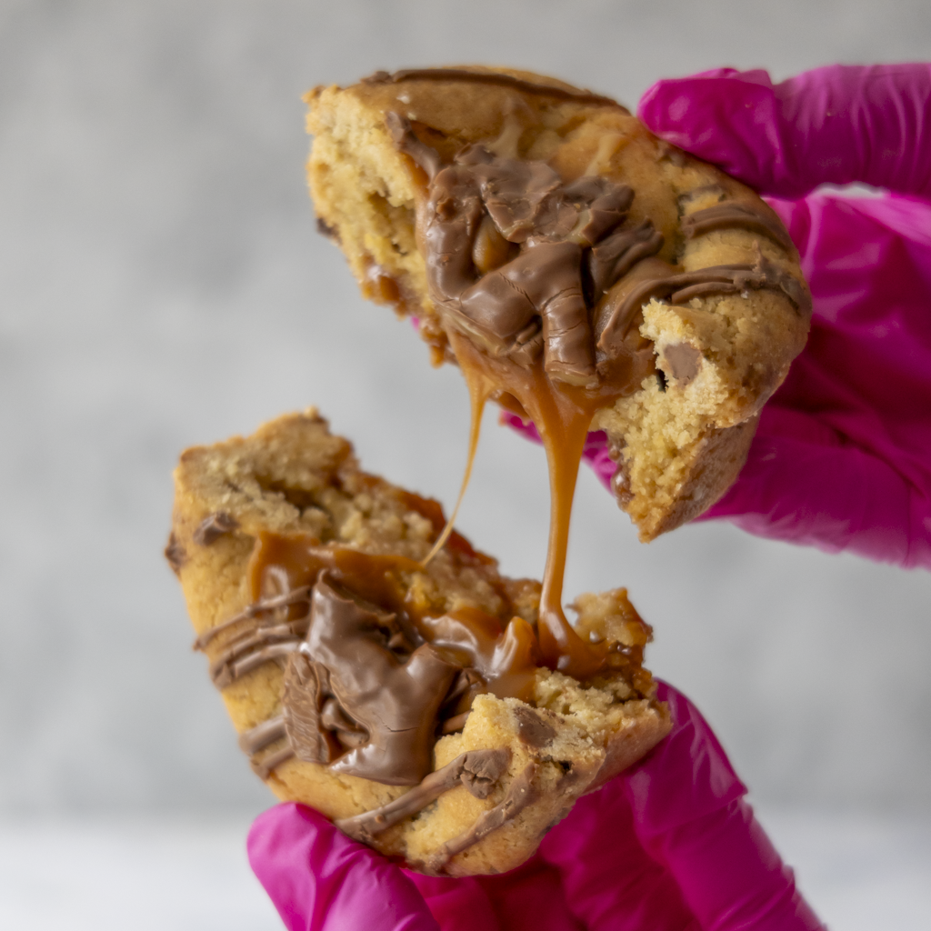 Close-up of Stuffed Deluxe Cookie with Curly Wurly showing caramel filling